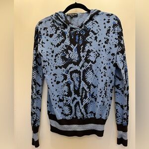 XS Central Park West snake pattern hoodie with embellished silver band.